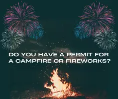 Campfire with fireworks in the background 