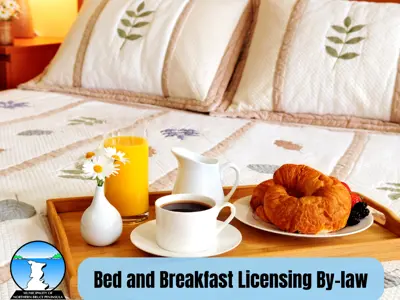 Picture of a breakfast tray full of pastries and coffee on a bed.