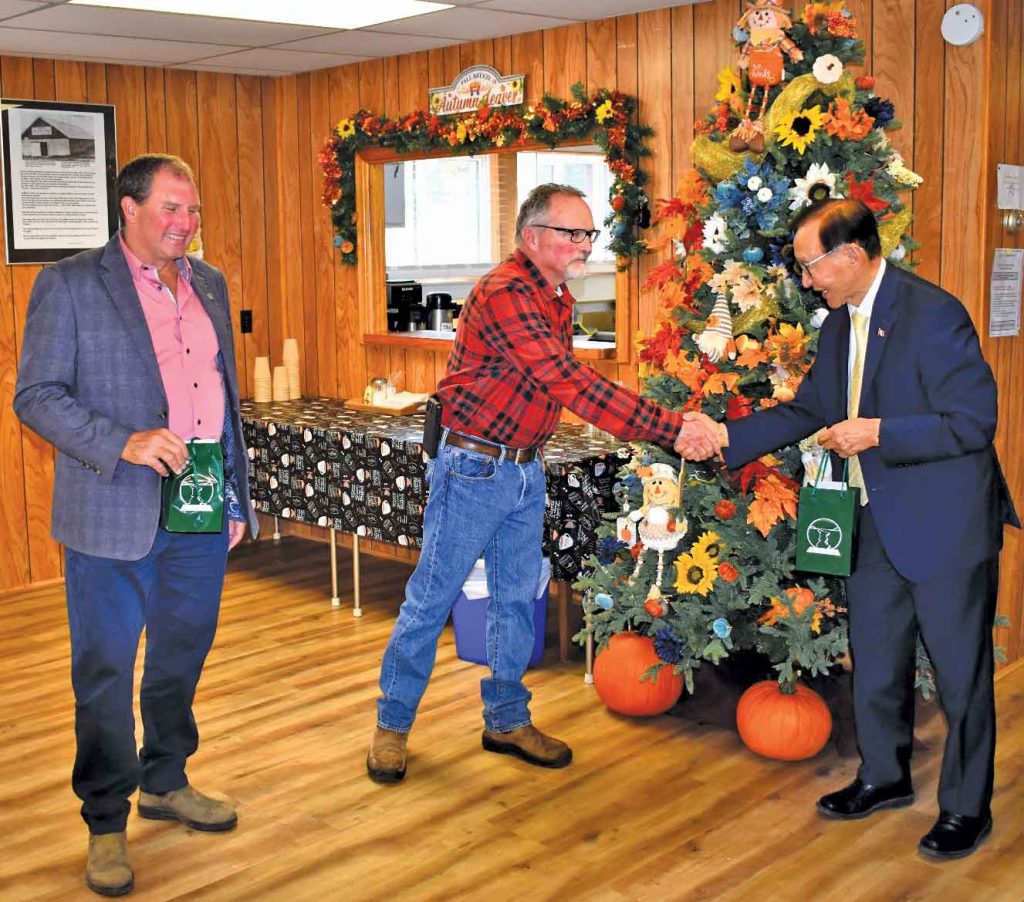 Minister Cho and MPP Vickers accepting a gift from Councillor Dowd on behalf of the Municipality.